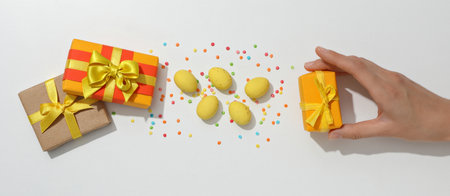 Chocolate eggs with gifts on a light background