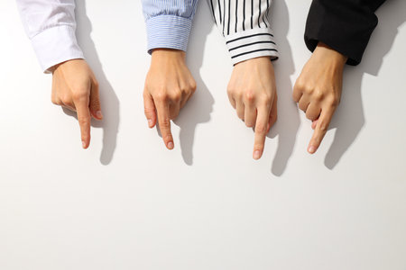 Hands of people on a light backgroundの写真素材