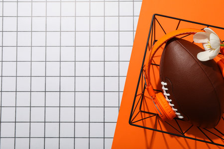 Rugby ball with flowers on an orange background.の写真素材