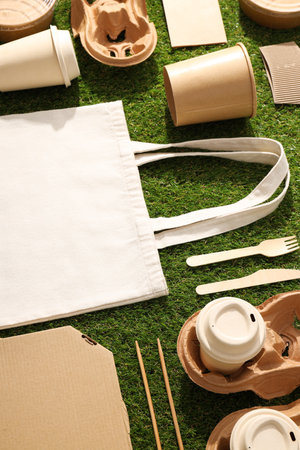 Ecological packaging for food delivery, on the grass.の写真素材