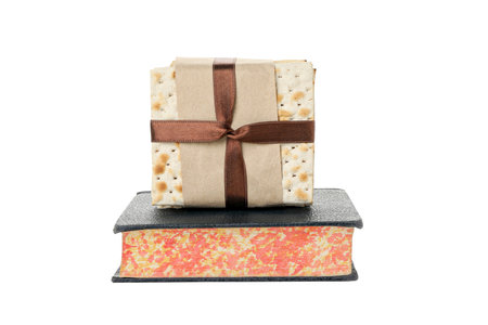 PNG, matzo on the Torah, isolated on white background