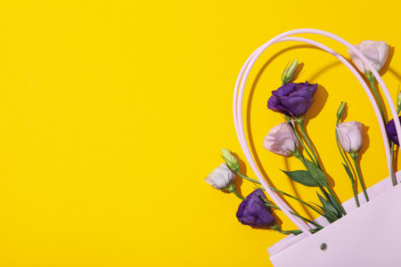 Beautiful purple flowers on a yellow backgroundの写真素材