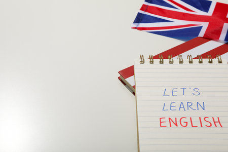 Notepad, Big Ben and the word "English" on a white background.の写真素材