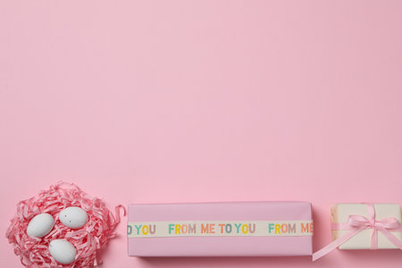Chocolate eggs in a nest with a gift
