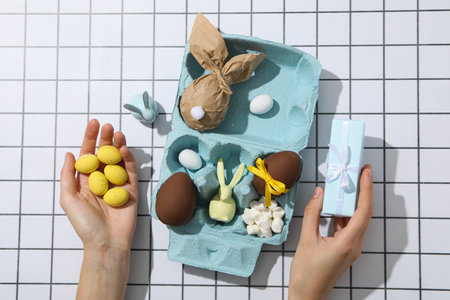 Chocolate eggs in a tray on a light background