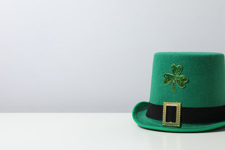Green hat with clover leaf on white background, space for textの写真素材