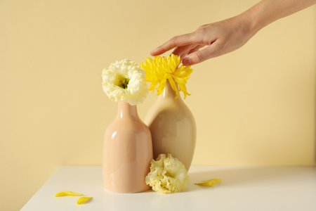 Fresh flowers in a vase on a light background.の写真素材