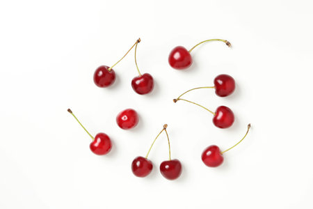 Ripe juicy cherry fruits on a white backgroundの写真素材