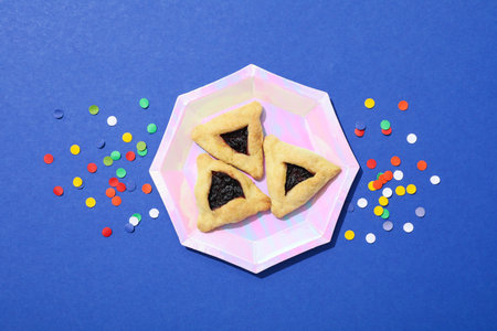 A mask with traditional cookies for the day of Purim.