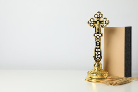 Cross, spikelets and book on white background, space for textの写真素材