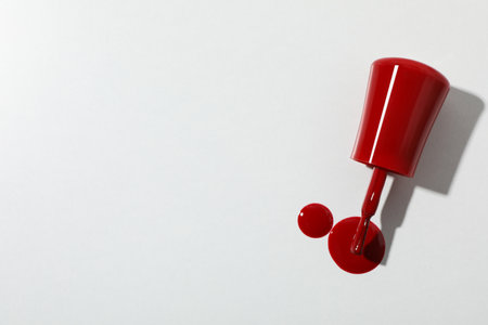Red nail polish on a white backgroundの写真素材