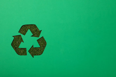 Material recycling sign on a green background