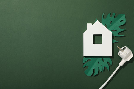 White decorative house with white electric cableの写真素材