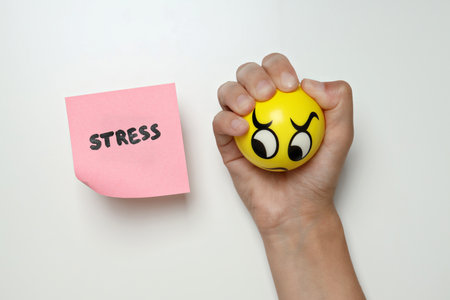 Stress theme concept, paper with inscription and not satisfied smiley.