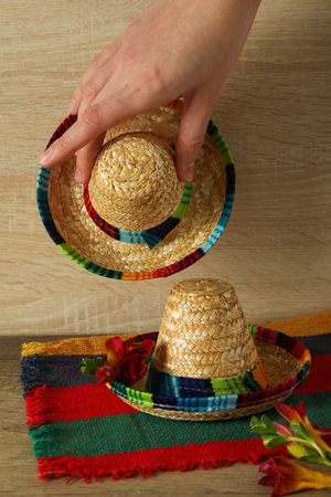 Sombrero with fresh flowers on a wooden backgroundの写真素材