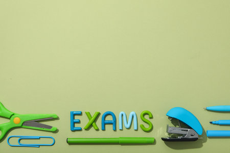 Inscription: "EXAM", on the table, top view.の写真素材