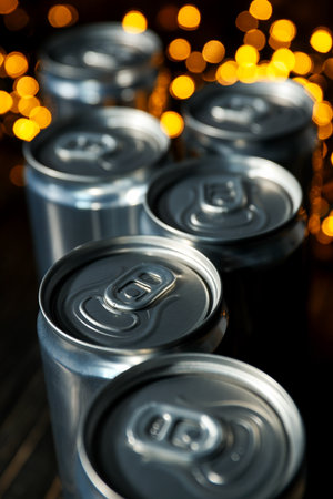 Tin cans for drinks on a dark background