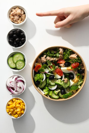 Tuna salad in a cardboard plate on a light table.の写真素材