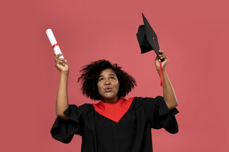 A young African American woman in a graduation uniformの写真素材