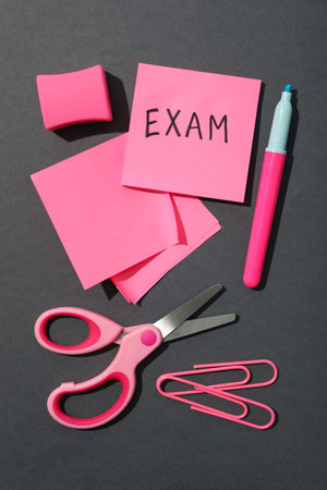 Exam, writing on a piece of paper.