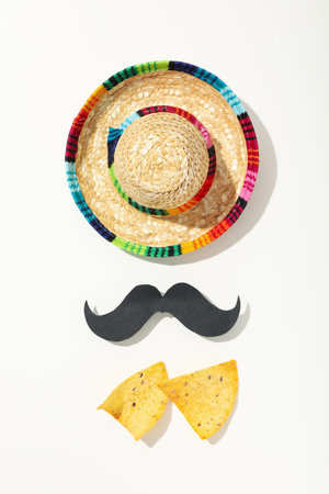 Sombrero with a decorative mustache on a light backgroundの写真素材
