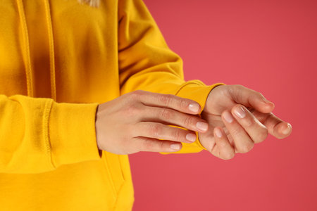 A young woman in a yellow hooded sweatshirtの写真素材