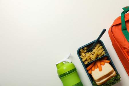 A school backpack with a lunch box with foodの写真素材