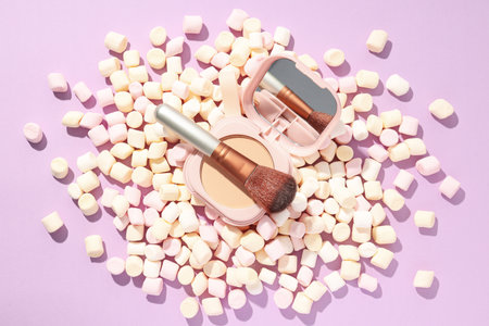 A bottle of loose powder, light shade, on a purple background.