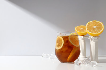 A glass of cold tea with fresh orange slicesの写真素材