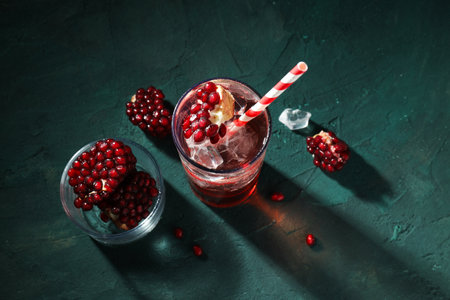 Red cocktail with fresh pomegranate in a glassの写真素材