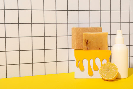 Soap, lemon and spray on light background, space for textの写真素材