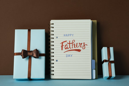 Happy father's day inscription, inscription in notebook, with gifts.の写真素材