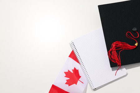 Graduate hat with Canadian flag and notepadの写真素材