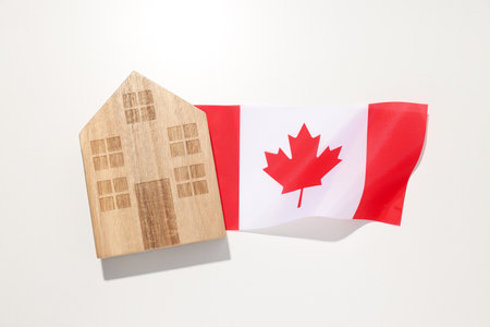 A wooden house with the flag of Canadaの写真素材