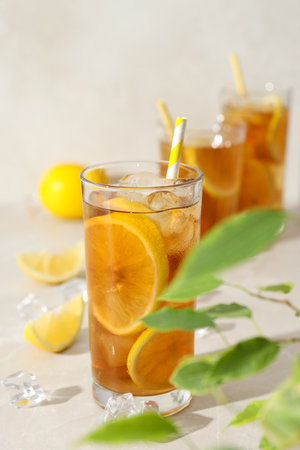 A glass of cold tea with fresh orange slicesの写真素材