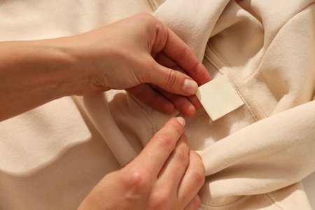 Warm stylish clothes with blank white labelの写真素材