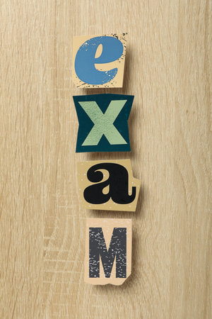 Inscription: EXAM, on the table, top view.