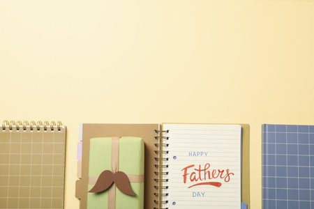 Happy father's day inscription, inscription in notebook, with gifts.の写真素材
