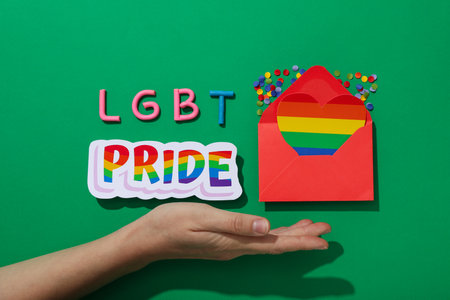 LGBT parade concept, envelope on green background.の写真素材