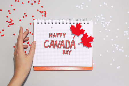 The inscription Happy Canada Day in a notebookの写真素材