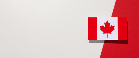 The flag of Canada on a white-red backgroundの写真素材