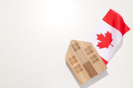 A wooden house with the flag of Canadaの写真素材