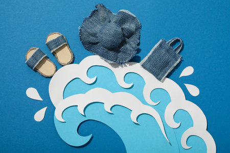 Waves with accessories for summer vacation on the beach.の写真素材
