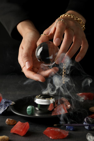 Magic orb of a witch, for divination of the future, on a dark background.の写真素材