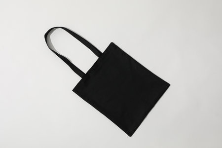 A black bag lies on a white backgroundの写真素材