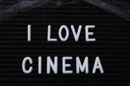 Black letter board with text and spider web, close upの写真素材