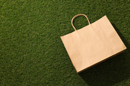 Ecological packaging for food delivery, on the grass.の写真素材