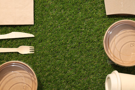 Ecological packaging for food delivery, on the grass.の写真素材