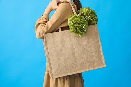 A bag with flowers on a woman's shoulderの写真素材