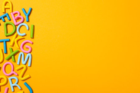 Alphabet made of colored plasticine on a light background.の写真素材